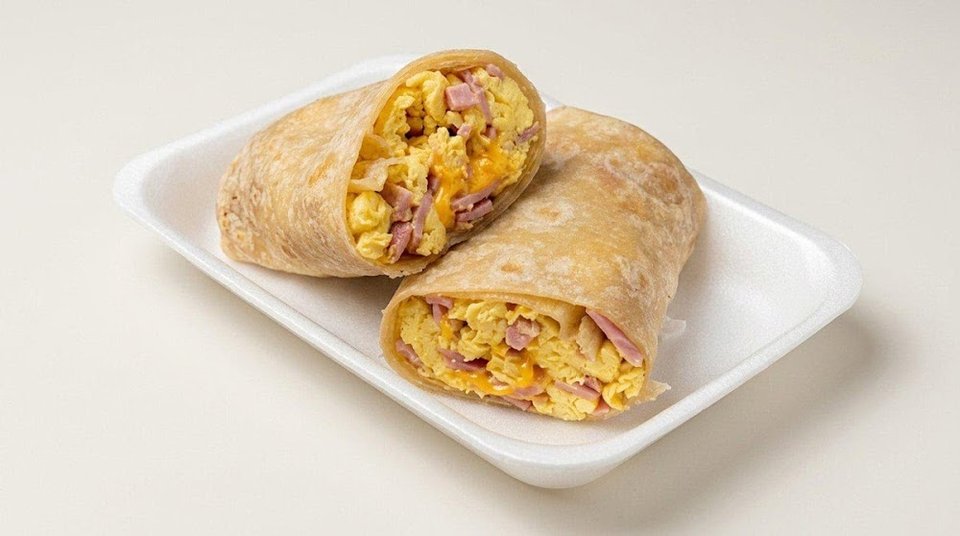 Printed menu showing burritos, tacos, and enchiladas.